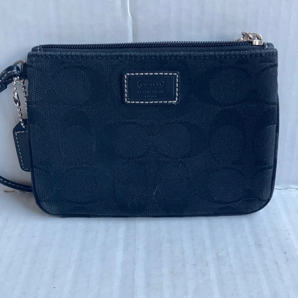 Coach black signature C mini wristlet.